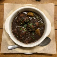 Frango em molho pardo, Galo Preto