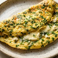 Omelette de hierbas y queso de cabra, Estación Cruda
